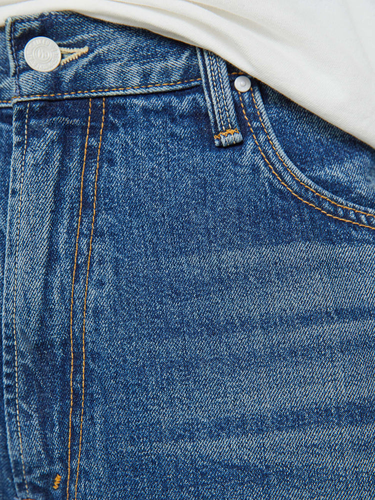 Swatch view of a men wide straight-leg jean with a high rise, 30-inch inseam, loose fit and a clean hem in mid blue wash.