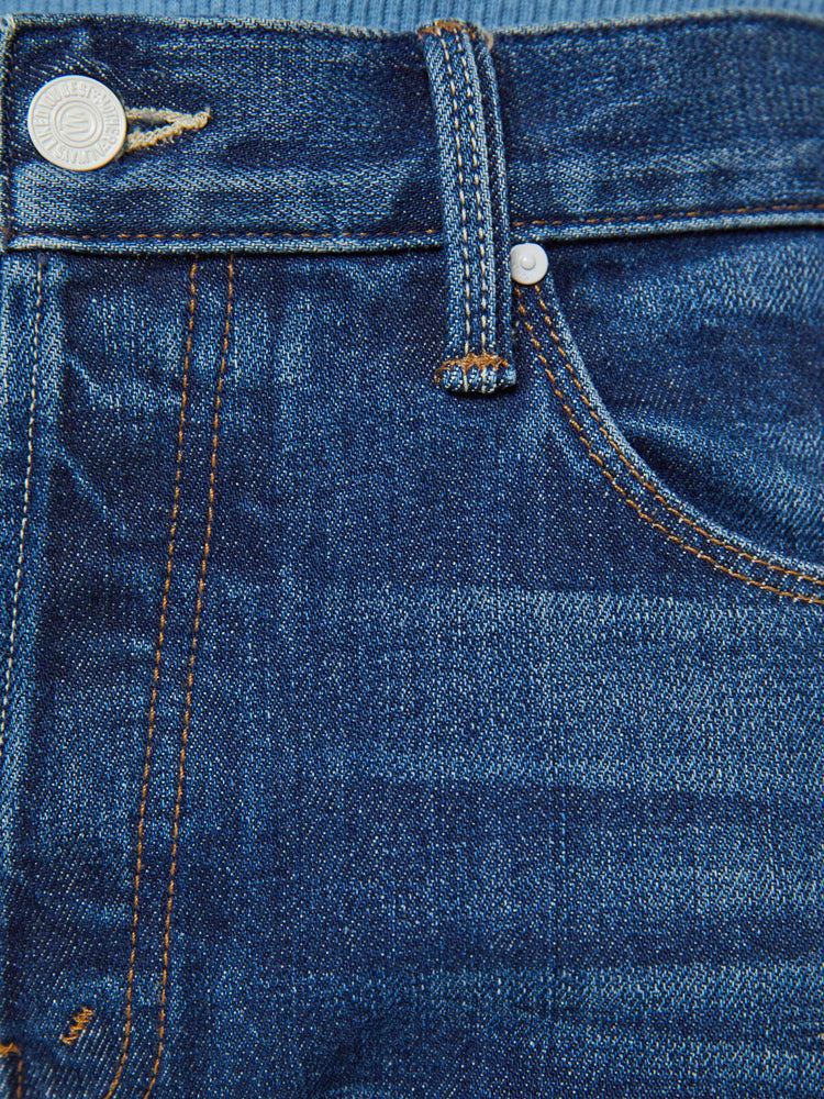 Swatch view of a man in a slim-straight leg with a mid rise, 32-inch inseam and a clean hem in a dark blue wash.