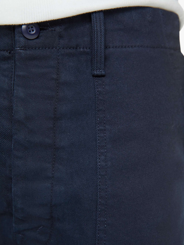 Swatch view of a man in an army pant with a slightly dropped crotch, patch pockets and a slim-straight leg in a navy blue wash.