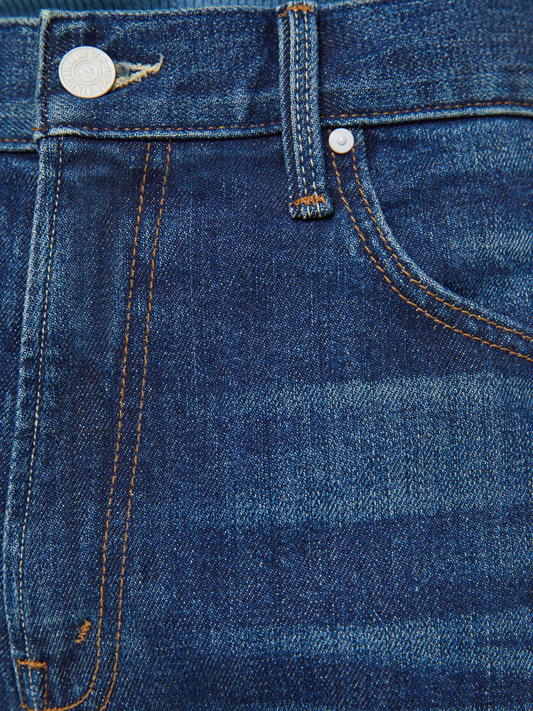 Swatch view of a man in a straight-leg jean with a mid rise, ankle-length inseam and a clean hem in a dark blue wash.