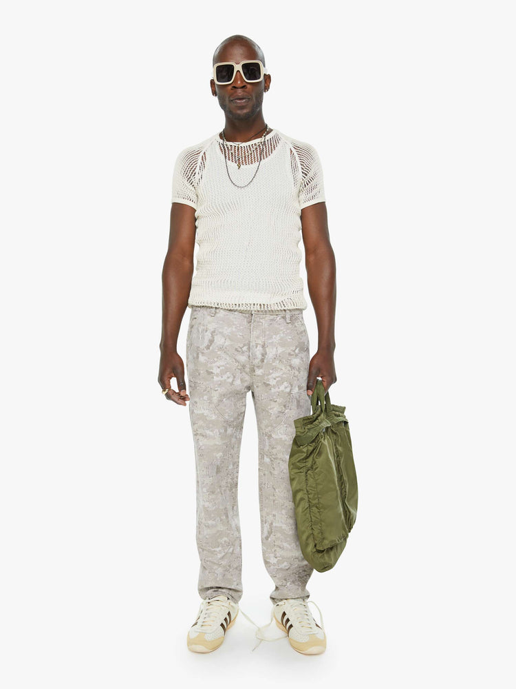 Front view of a mens mid-rise, straight-leg cargo pant with slit pockets, a hammer loop and utility-inspired patches at the knees in a neutral camo print.