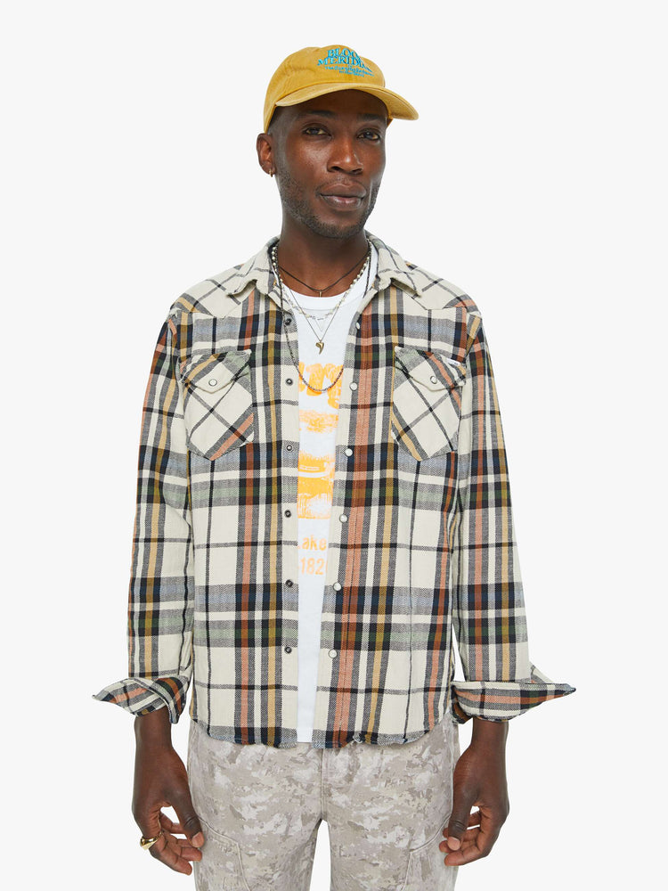 Front view of a mens plaid print with patch pockets, long sleeves and a curved hem.