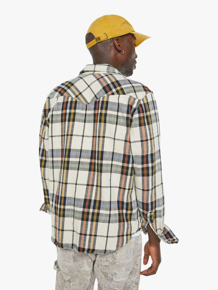 Back  view of a mens plaid print with patch pockets, long sleeves and a curved hem.