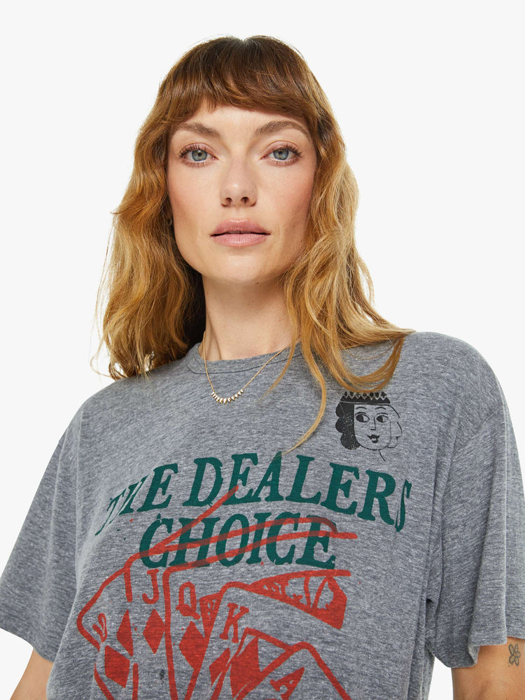 WOMEN front close up view of a an oversized tee with drop shoulders in a heathered grey with a faded feck of cards with text in green in the front.