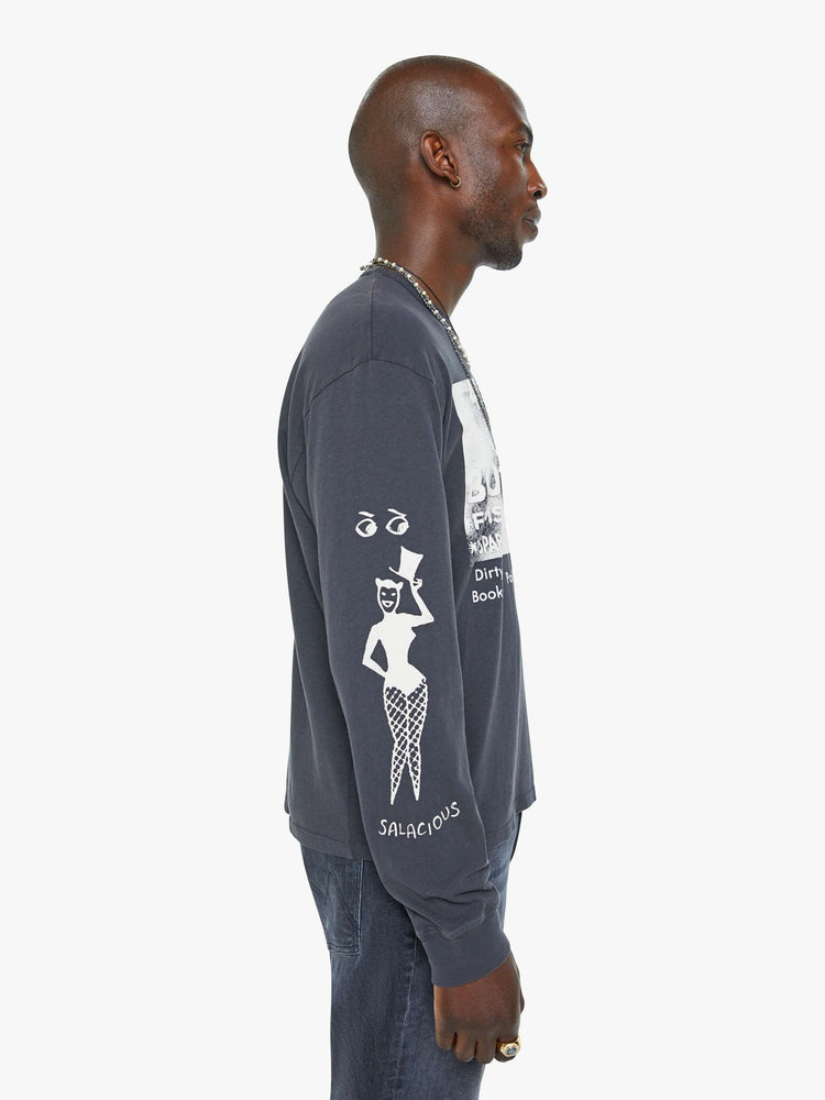 Left side view of a man oversized long sleeve tee with drop shoulders and a loose fit in a faded black with an advertisement in white on the front.