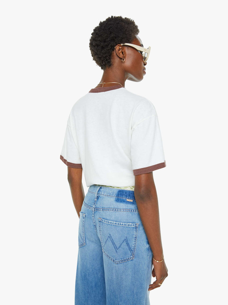 WOMEN back view of an oversized tee with drop shoulders and a loose fit in white with brown trim.