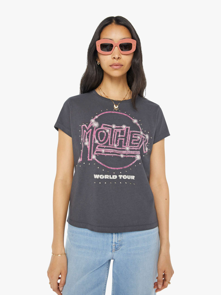 Front view of a woman in a dark grey tee with a merch-inspired graphic on the front and back with rhinestones and studs throughout.