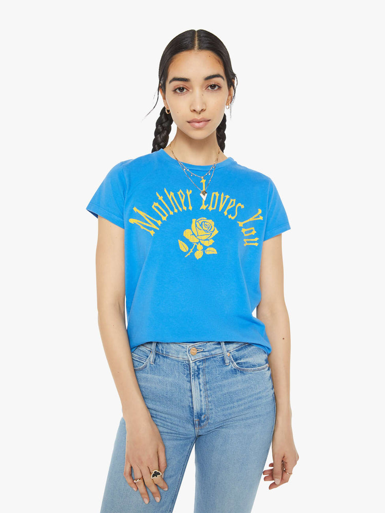 Front view of a woman blue tee with a message from MOTHER and a yellow rose on the front.