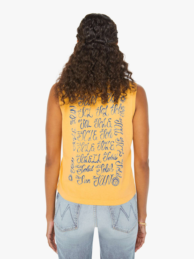 Front view of a woman in a yellow cropped muscle tee that features "El Sol" text in blue.