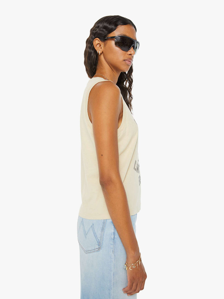 Side view of a woman in a colorful desert cactus graphic cropped muscle tee with a crewneck and boxy fit.