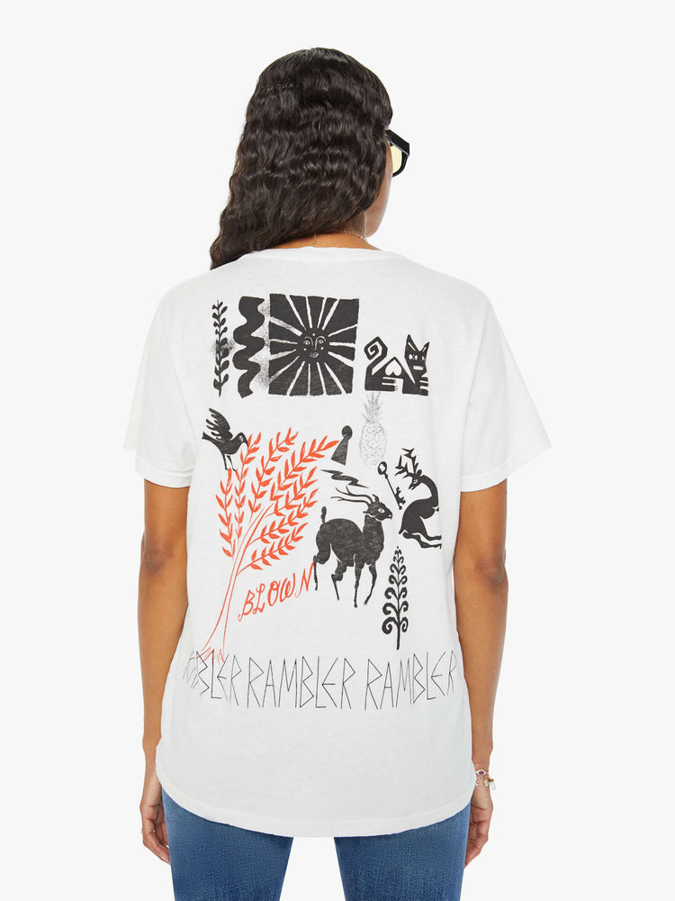Back view of a woman crewneck tee with an oversized fit and a clean hem with hand drawn doodles in black and orange throughout.