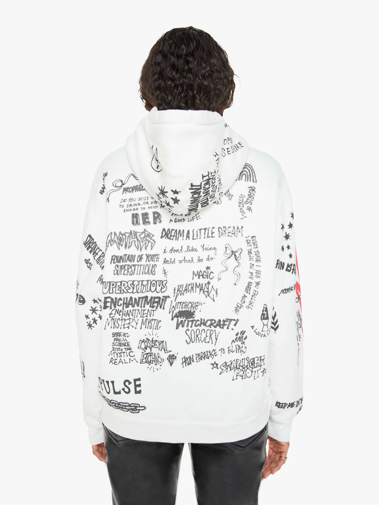 Back view of a woman in a classic hoodie with drop shoulders, a front patch pocket and ribbed hems in white  and red smiley face with drawn scribbles.