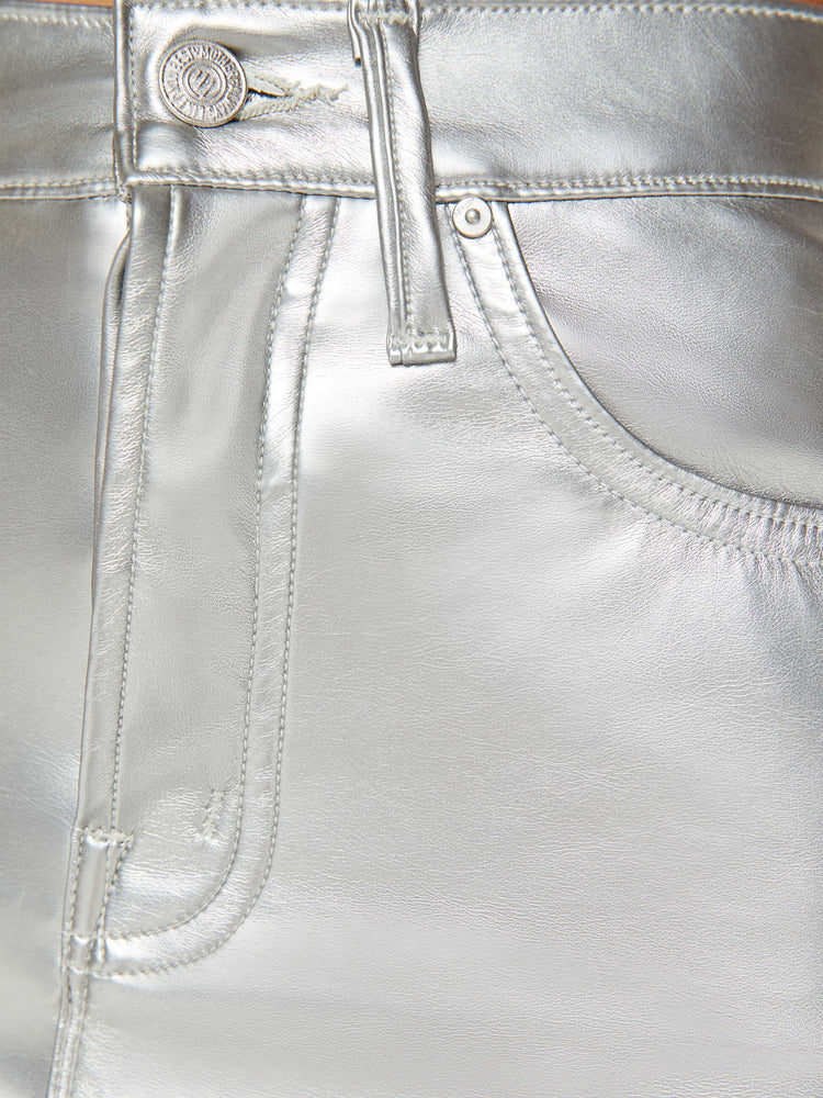 Swatch view of a woman in a light silver mini skirt designed to be worn lower on the hips with a zip fly, slim fit and thigh-grazing hem.