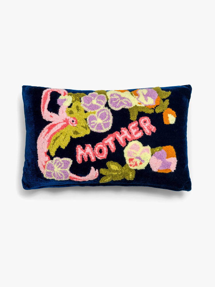 Flat view of a cozy, navy blue throw pillow with colorful leaves, flowers and MOTHER's name in pink on the front.