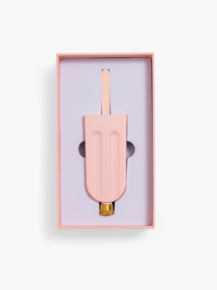 In box view of a pink popsicle-shaped flask crafted from alloy with a handle and metal screw top.