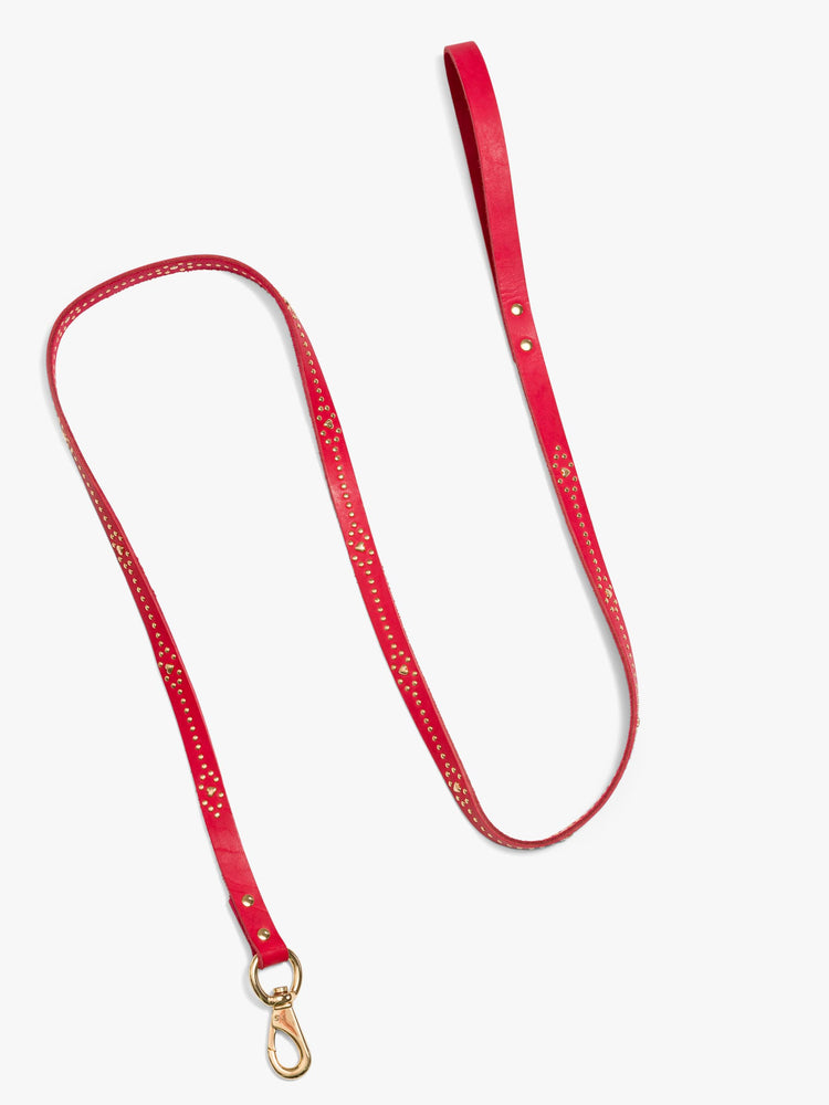 A flat lay view of a leash made from 100% leather in red and is best for medium to large dogs.