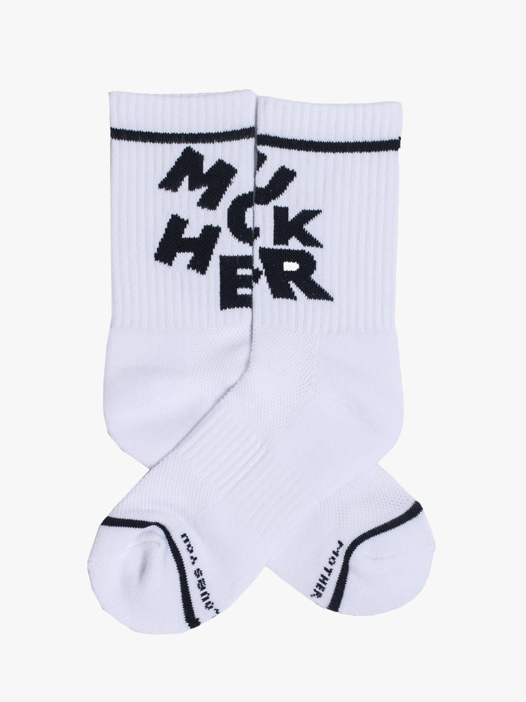 View of white classic tube socks with a bold message in black from MOTHER. 