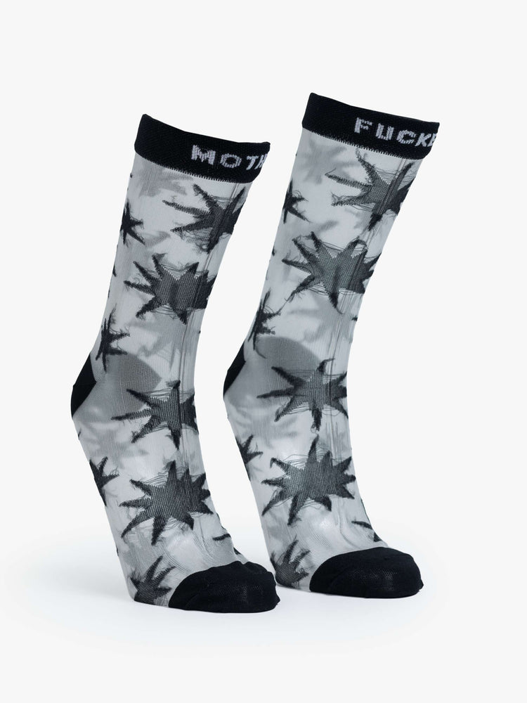 Translucent grey fabric with black stars, black trim and text in white socks.