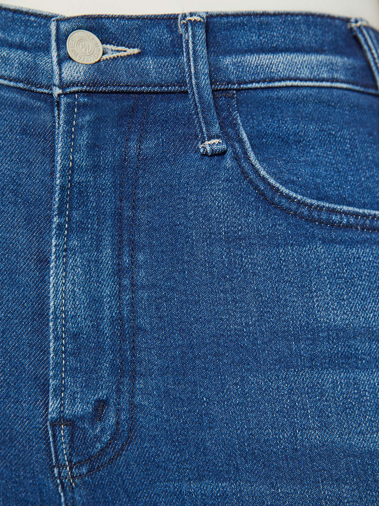 Swatch  view of a petites high rise bootcut with a 26.5 Inch seam and a frayed hem in a dark blue wash.