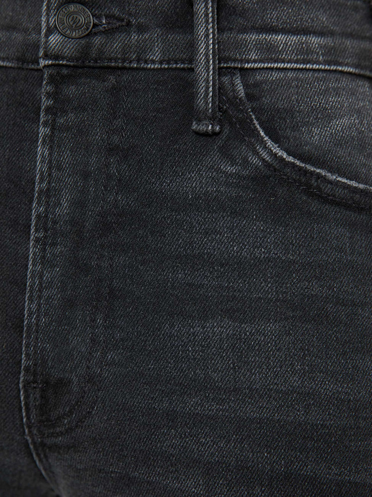 Swatch view of a petite woman in a black wash  wide leg jeans with a high rise, 30-inch inseam and a clean hem. 