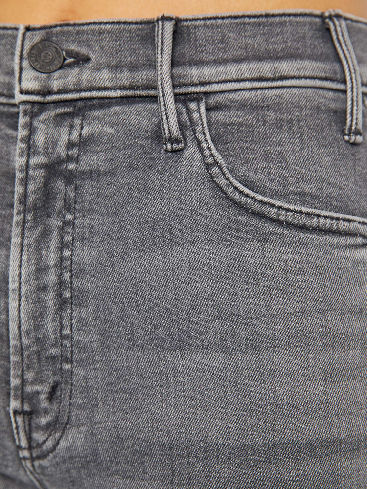 Swatch view of a woman in a grey High-waisted flare jeans with a longer inseam and a clean hem.