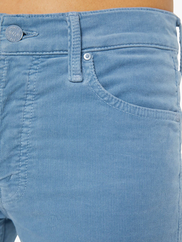 Swatch view of a woman in a light blue corduroy slim straight-leg features a mid rise, button fly, low-set back pockets and a clean hem. 