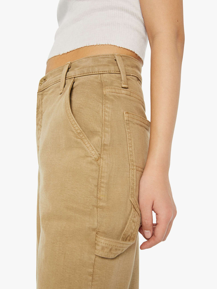 Close up view of a petite woman in a super high-waisted pants with a loose, straight leg, utility-inspired patch pockets, a hammer loop and a long 30-inch inseam with a clean hem.