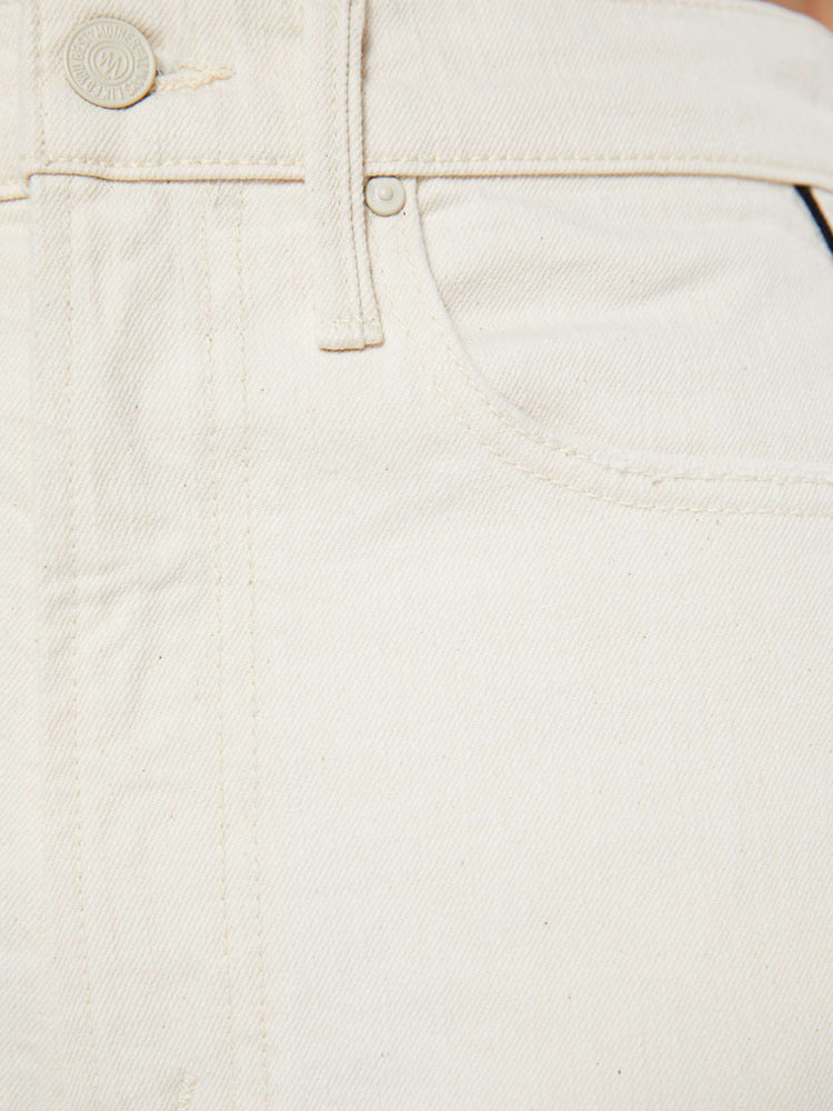 Swatch view of a woman in a super high-waisted jean with a wide, curved leg, an ankle-length inseam and a clean hem in a creamy white color.