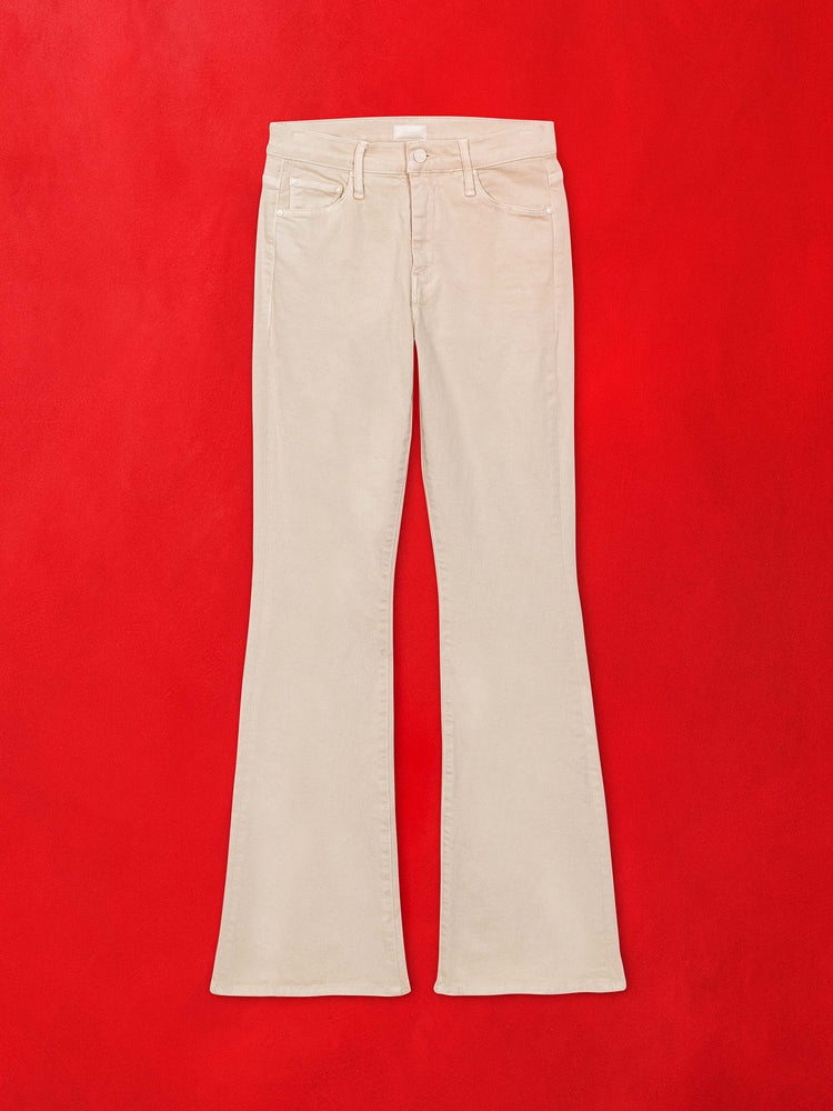 A flat image of a pair of cream colored flare pants against a red background.