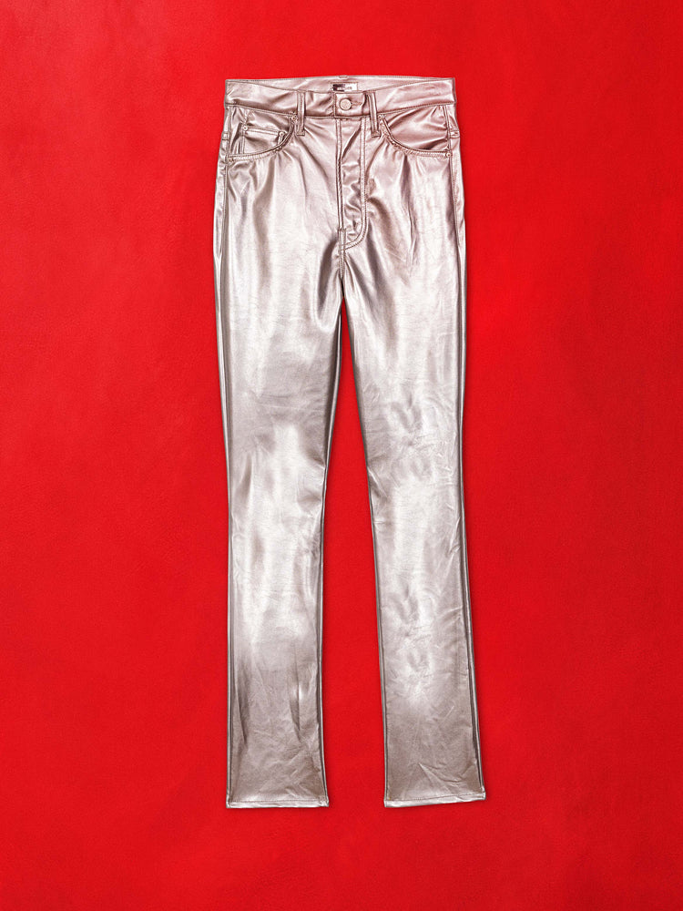 Flat image of metallic silver pants against a red background.