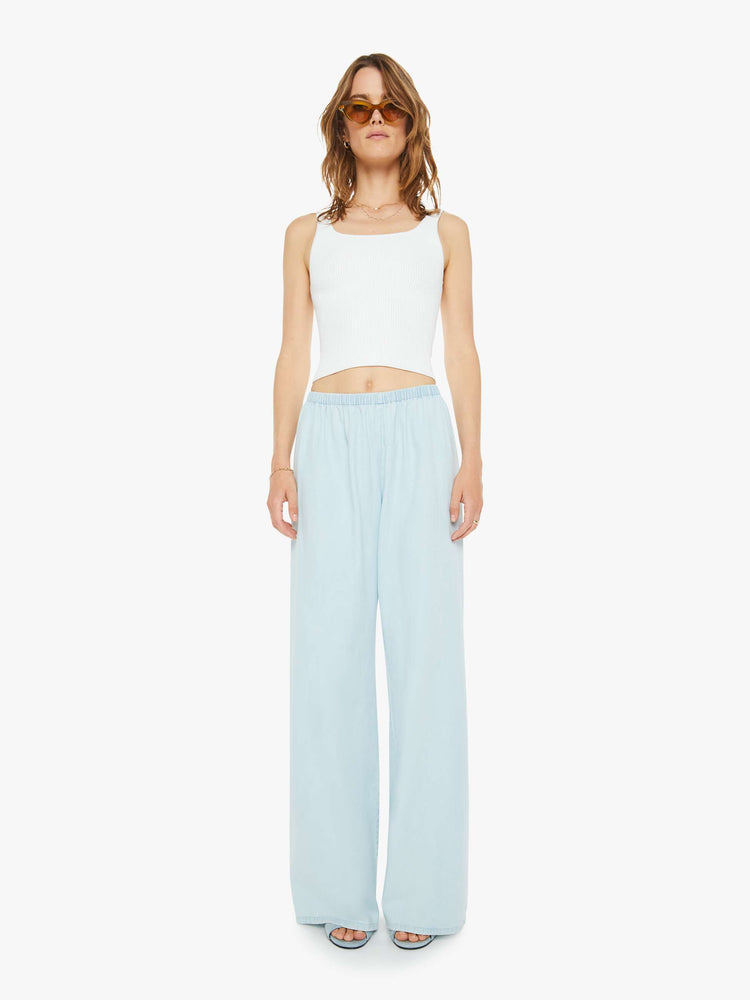 Front view of a woman sky blue pants with an elastic waistband and a comfortable fit.