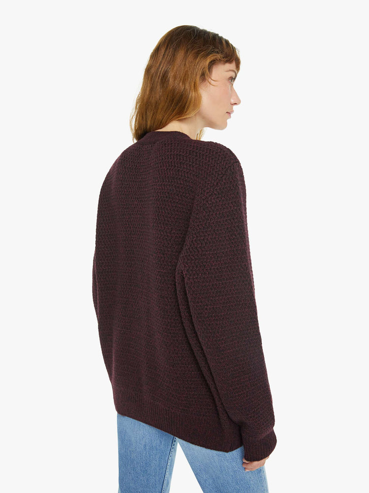 WOMAN back view in dark maroon vneck cardigan.