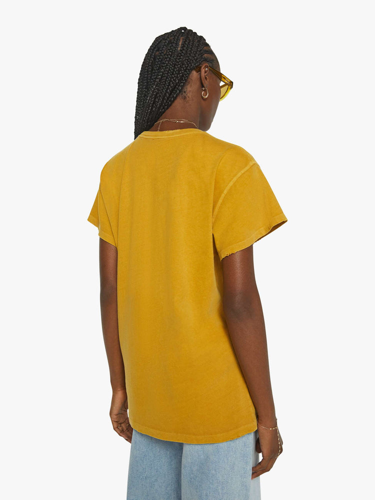 Back view of a mustard yellow crew neck tee featuring a Rolling Stones graphic.