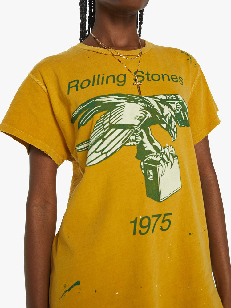 Front close up view of a mustard yellow crew neck tee featuring a Rolling Stones graphic.