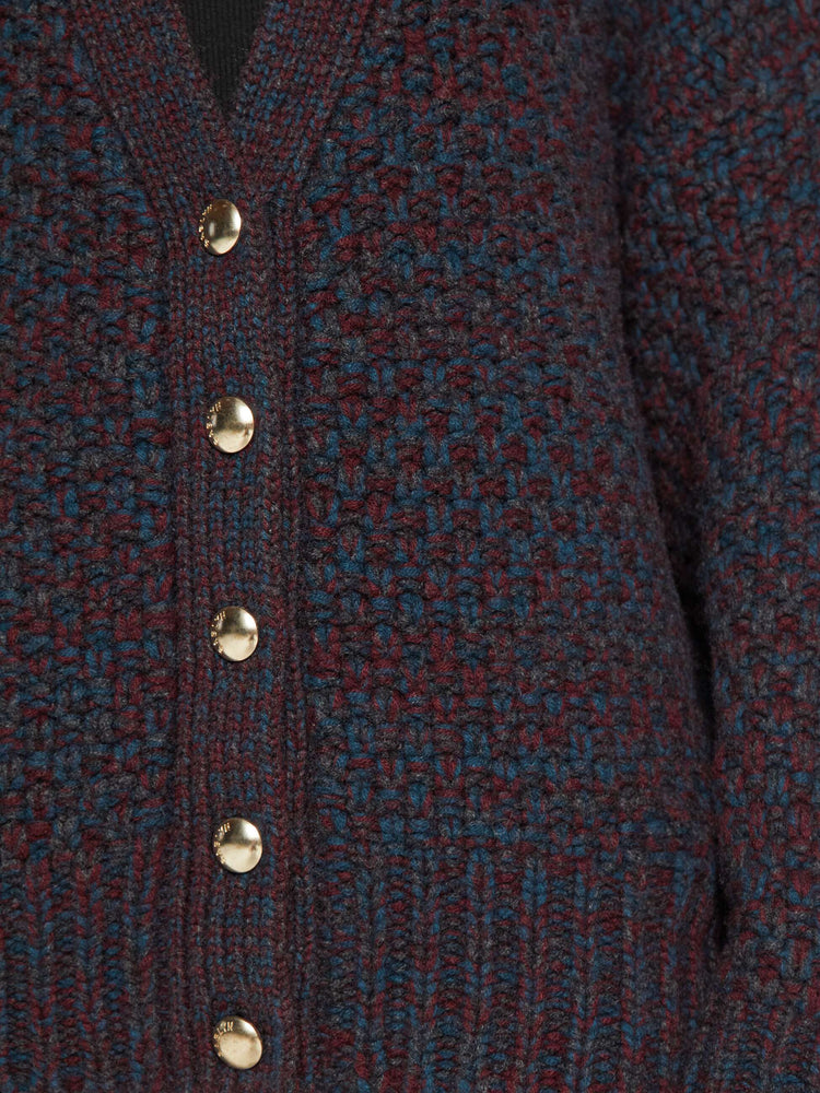 Swatch view of a woman in rich red cardigan with a deep V-neck, drop shoulders, ribbed hems and a cropped, slouchy fit. 