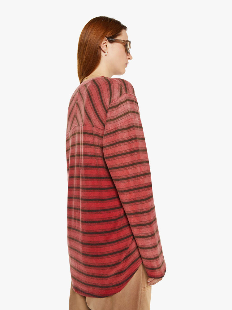 WOMAN back view in long sleeve Tee features drop shoulders, extra-long sleeves and a boxy fit in red with black stripes.