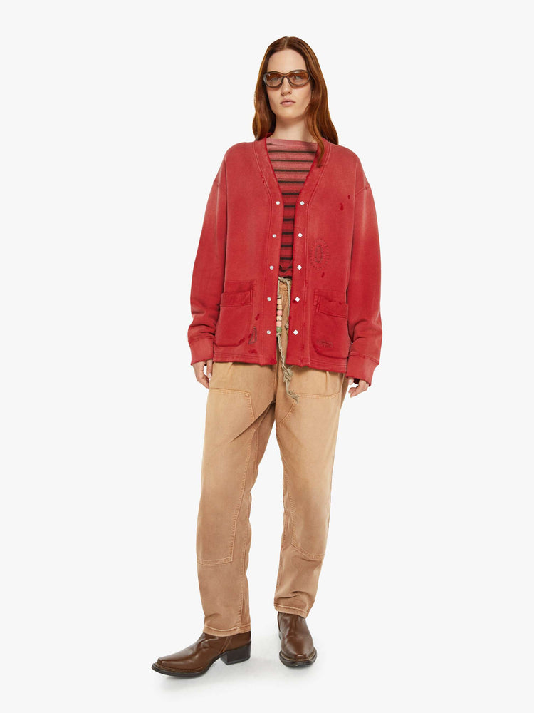 WOMAN full body view in a V-neck, drop shoulders, patch pockets and ribbed hems red cardigan.