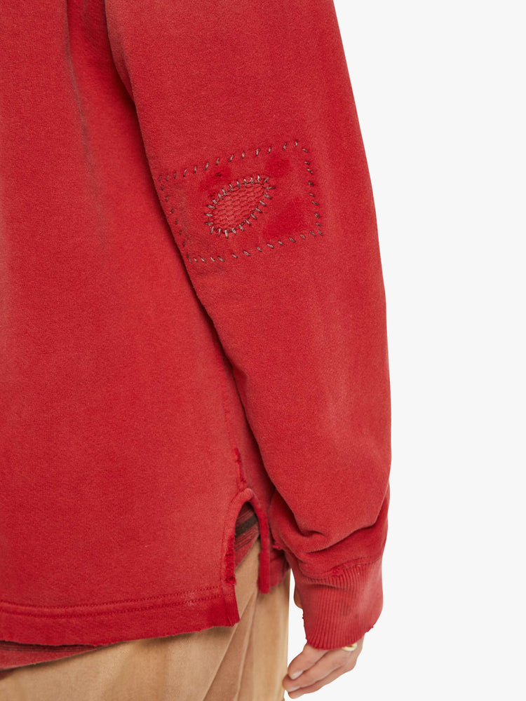 WOMAN close view in a V-neck, drop shoulders, patch pockets and ribbed hems red cardigan.