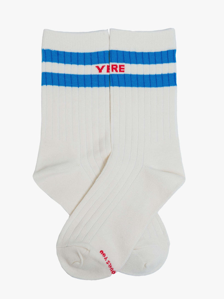 Flat view of a tube socks with a message from MOTHER. Shown here in cream with red text and blue details.